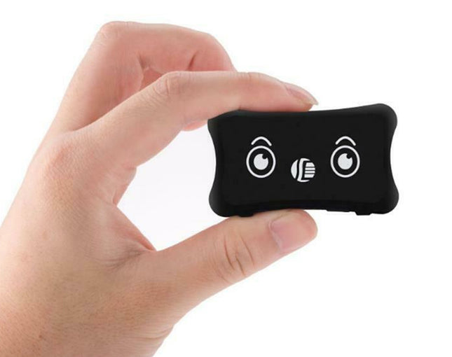 A hand holding a small black rectangular electronic device with white printed icons on a plain white background.