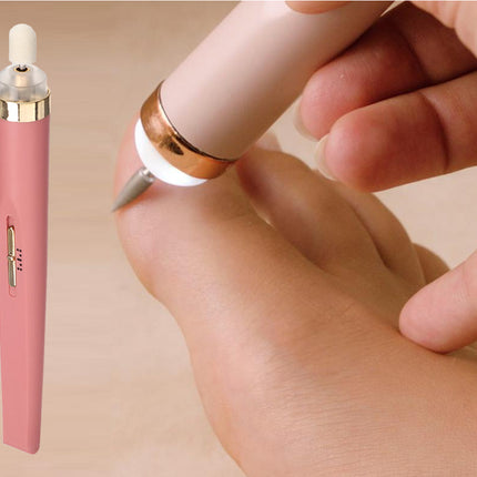 Pink electronic device being used on a hand with a beige background