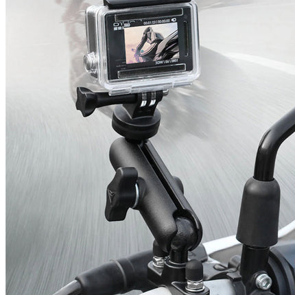 Action camera mounted on a motorcycle handlebar with a blurred background