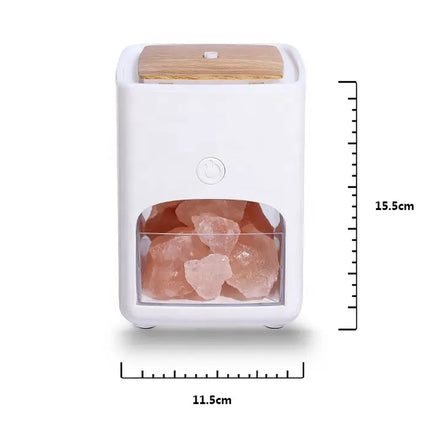 A white salt holder with a light wood lid and a clear front window showing pink Himalayan salt crystals inside, with dimension lines indicating 15.5 cm height and 11.