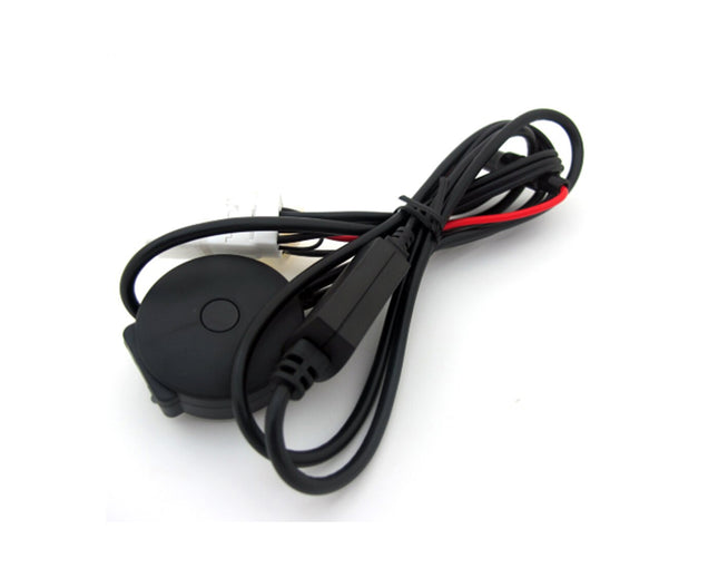 Black electronic component with a cable on a white background