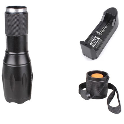 Black flashlight with battery pack and holder on a white background