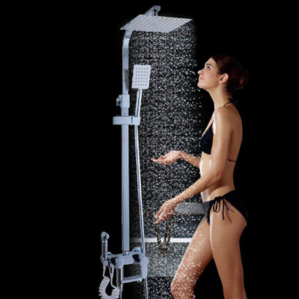 Woman in a black bikini standing under a shower with a modern shower head and control panel.