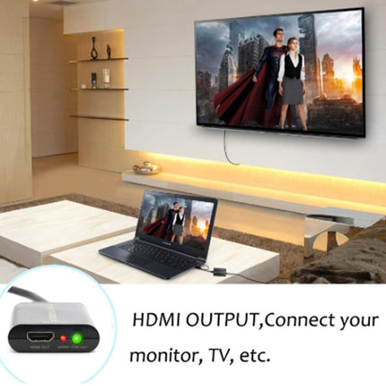 Laptop displaying a movie on a TV in a living room with HDMI output feature highlighted.