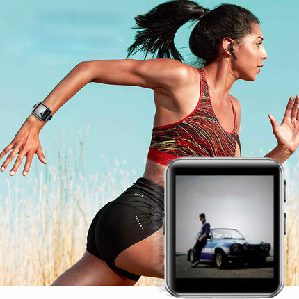 A woman running outdoors wearing a smartwatch, with a tablet in the foreground displaying a photo of a blue sports car. The background shows a grassy field under a clear blue sky.