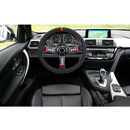 A black leather steering wheel cover with red stitching and red accent lines on a car's multi-function steering wheel, shown inside a black car cabin.