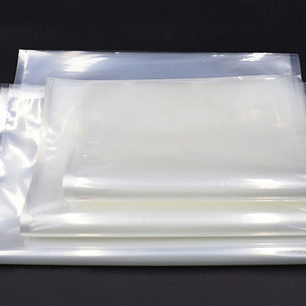 Stack of clear plastic bags on a black background