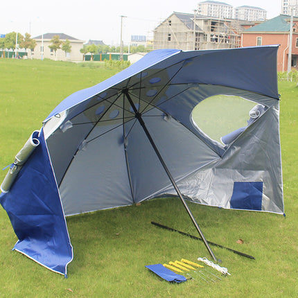 Large umbrella with a golf simulator screen on a grassy area