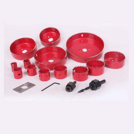 Set of red hole saws and related tools on a white background