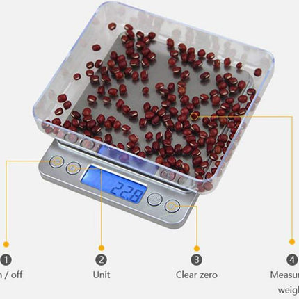 Digital scale with red beans on a white background