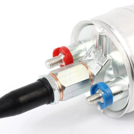 A close-up of a cylindrical metal automotive part, likely a fuel pump module, featuring a black rubber connector, silver metal body, copper washer, and red and blue plastic thread seals on a white background.