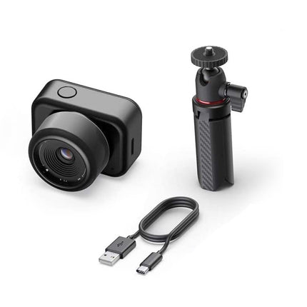 Small camera with accessories on a white background