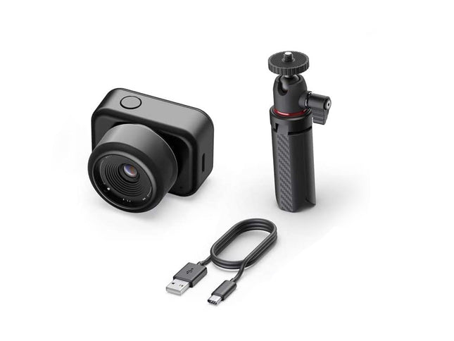 Small camera with accessories on a white background