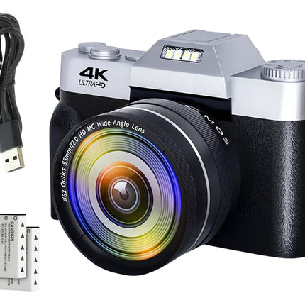 Digital camera with lens, USB cable, and battery on a white background