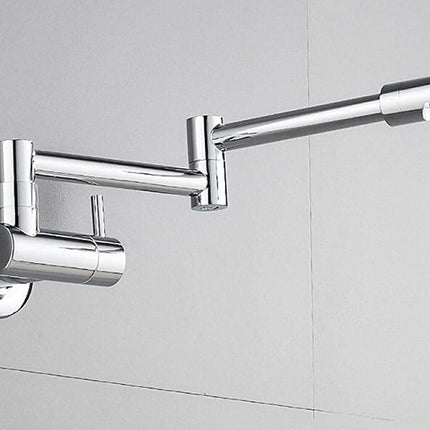 A polished chrome wall-mounted adjustable faucet with an extended spout and a stream of water flowing from the tip, set against a light gray tiled wall.