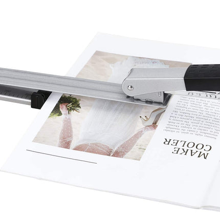 Magazine being scanned by a flatbed scanner on a white background