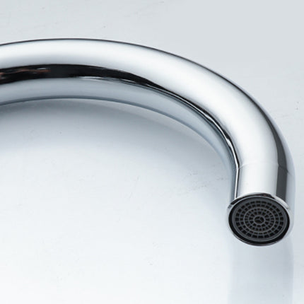Close-up of a chrome kitchen faucet on a white background
