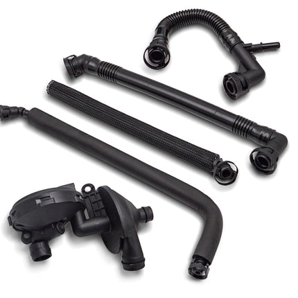 Set of black metal automotive parts on a white background