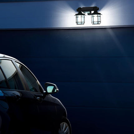 Car parked under a security light at night