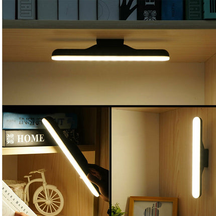 Modern wall-mounted light fixture in a home setting with books and decor.
