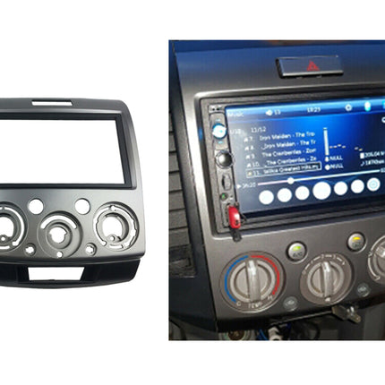 Car stereo dashboard with radio and climate control knobs on a white background