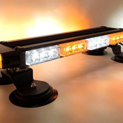 LED warning light bar with amber and white lights on a reflective surface.
