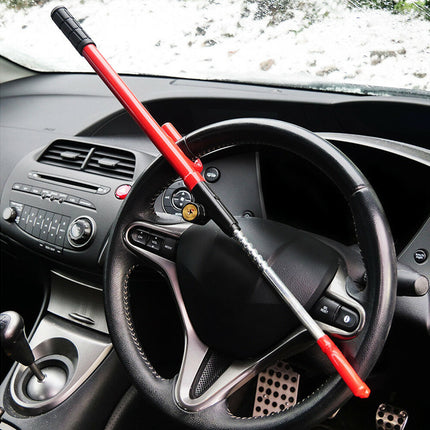 Steering wheel with a red tool on a car dashboard