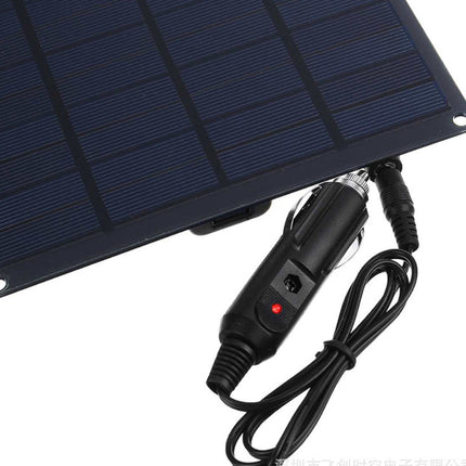 Solar panel with charging cable on a white background