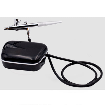 Black airbrush machine with cable on a white background
