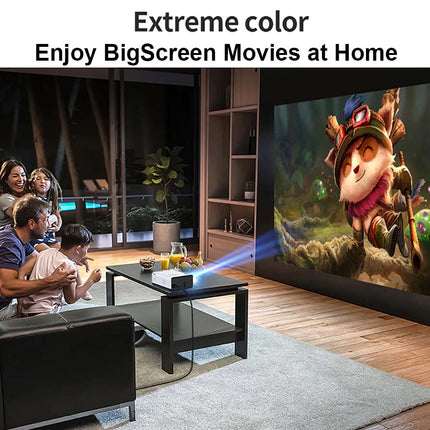 Family watching a movie on a large screen with a projector in a living room.