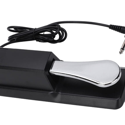 Black foot pedal with silver pedal and cable on a white background