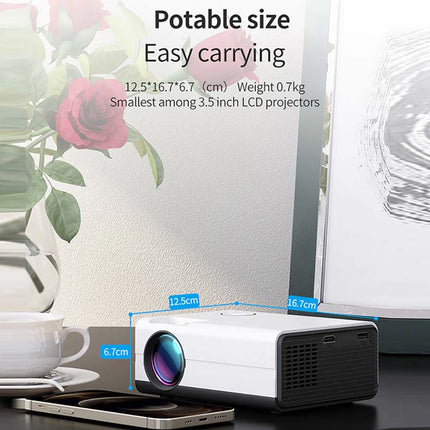 Portable projector with dimensions and weight displayed, next to a cup and phone.