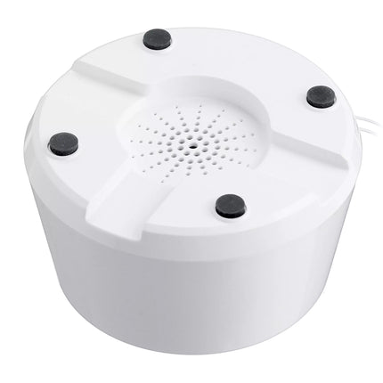 White cylindrical speaker with black accents on a white background