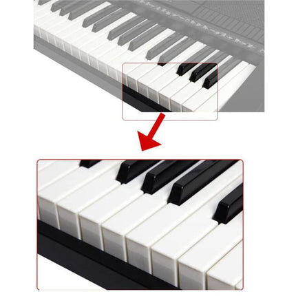 Close-up of a keyboard with white and black keys, showing a section of the keys.
