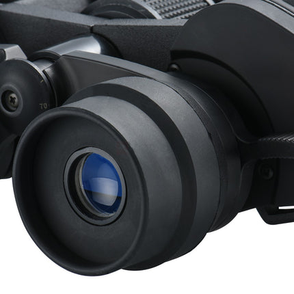 Close-up of a black binoculars with a blue lens on a white background