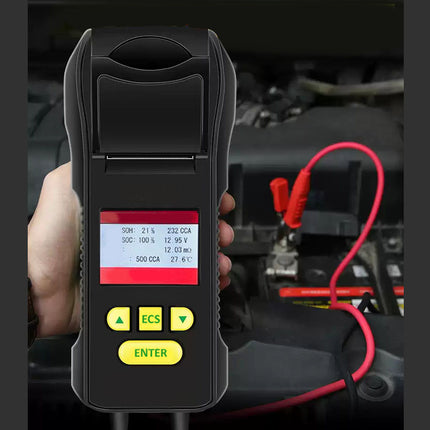 Car diagnostic tool held in a hand with vehicle interior background
