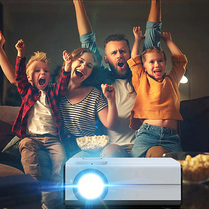 Family watching movie or show with projector on table