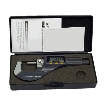 Digital micrometer with a black display screen and gray body, presented inside an open black foam storage case with a manual sheet on a white background.