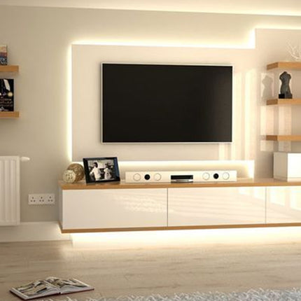 Modern living room with a TV mounted on a wall with built-in lighting and wooden shelves.