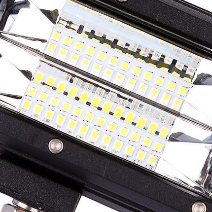 Close-up of a LED light bar with visible components on a white background