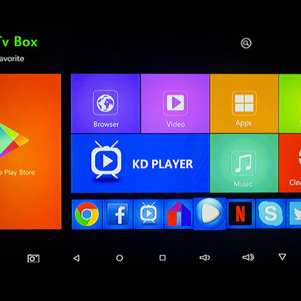 A close-up of a smart TV box or streaming device screen showing a colorful interface with app tiles including Browser, Video, Apps, Settings, Google Play Store, KD Player, Music, and Clean Memory on a black background.