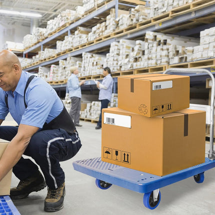 Worker in a warehouse with boxes and a dolly