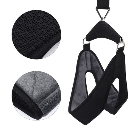 Black pet harness with close-up details on a white background