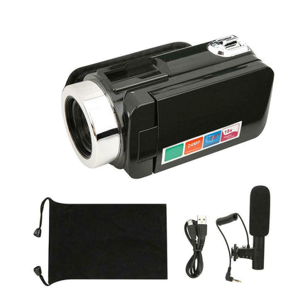 Black video camera with accessories on a white background