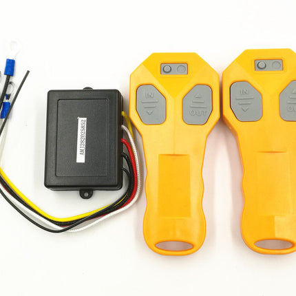 Two yellow remote controls with wiring on a white background