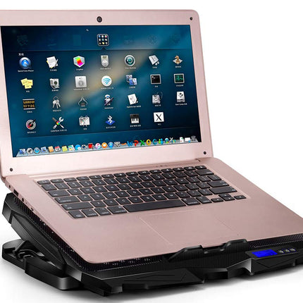 Laptop on a cooling pad with a white background