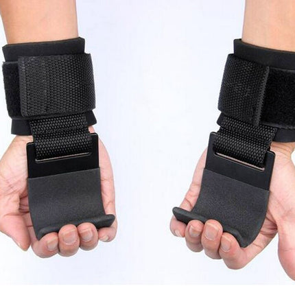 Black wrist support straps on hands against a white background