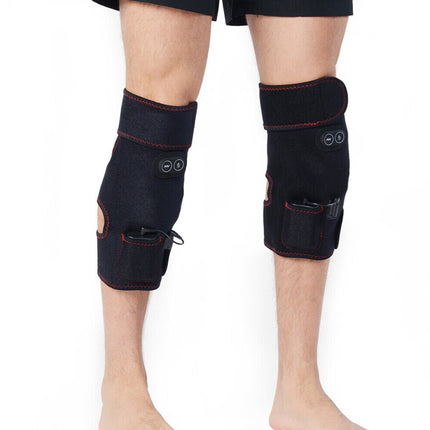 Black knee brace on a person's legs against a white background
