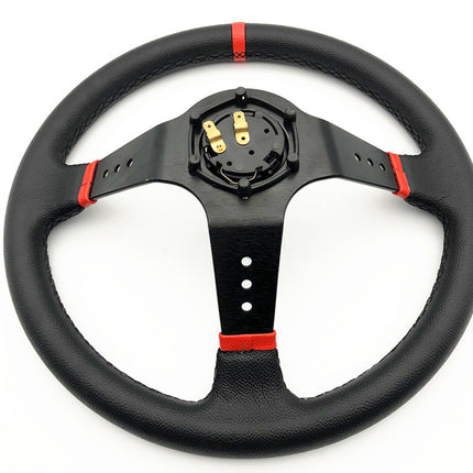 A black leather steering wheel with red accent stripes and a black center console, photographed on a solid white background.