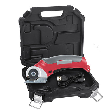A red and gray cordless utility tool with a black USB charging cable, displayed inside an open black plastic carrying case on a white background.
